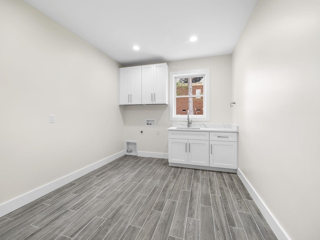 162 Clearcreek, Boiling Springs, SC 29316 - laundry room with cabinet space, hookup for a washing machine, light wood-style flooring, electric dryer hookup, and recessed lighting