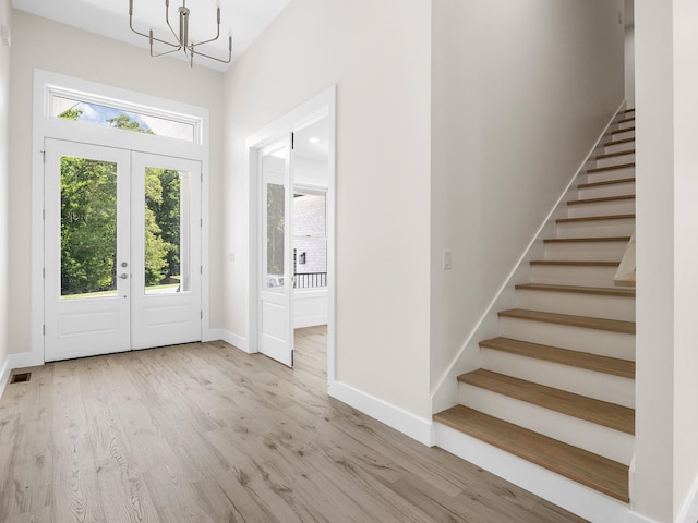 162 Clearcreek, Boiling Springs, SC 29316 - foyer featuring a chandelier, stairs, wood finished floors, a towering ceiling, and french doors