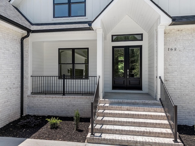 162 Clearcreek, Boiling Springs, SC 29316 - view of exterior entry featuring french doors, board and batten siding, and covered porch