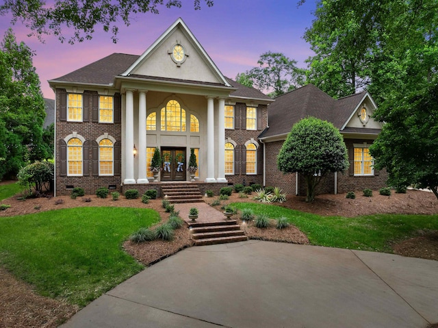 504 Carolina Clb, Spartanburg, SC 29306 - neoclassical / greek revival house with french doors, a yard, and brick siding