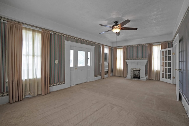283 Hydrick, Spartanburg, SC 29306 - unfurnished living room with carpet floors, a ceiling fan, and a fireplace with flush hearth