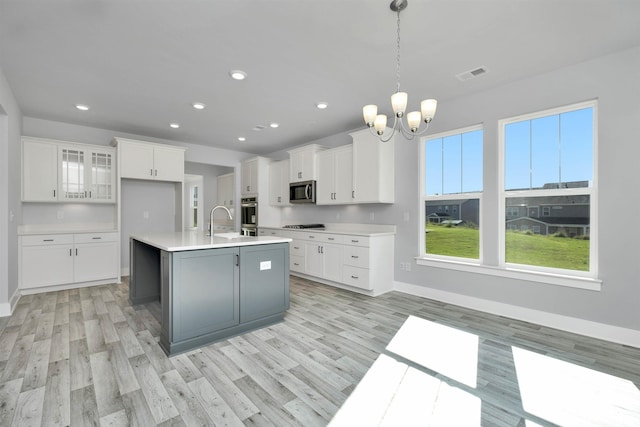 913 Wild Pne, Duncan, SC 29334 - kitchen featuring a chandelier, light wood-style floors, white cabinetry, stainless steel appliances, and recessed lighting