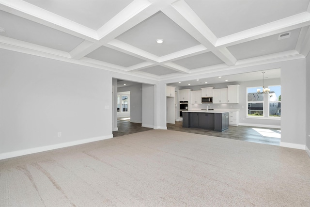 913 Wild Pne, Duncan, SC 29334 - unfurnished living room featuring coffered ceiling, a chandelier, dark carpet, recessed lighting, and beam ceiling