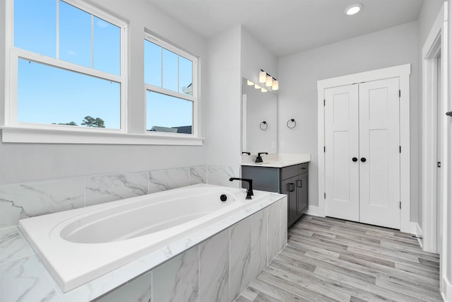 913 Wild Pne, Duncan, SC 29334 - bathroom featuring vanity, a bath, wood finished floors, and recessed lighting