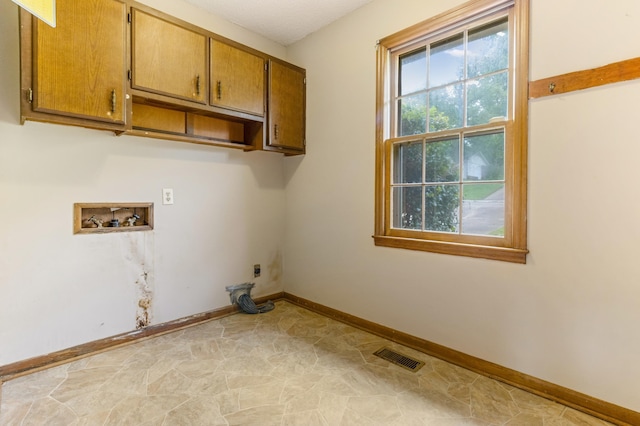 207 Oakmont Dr, Spartanburg, SC 29316 - laundry area featuring cabinet space, washer hookup, and electric dryer hookup