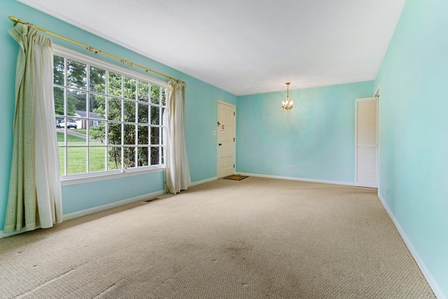 207 Oakmont Dr, Spartanburg, SC 29316 - carpeted spare room with a chandelier and baseboards