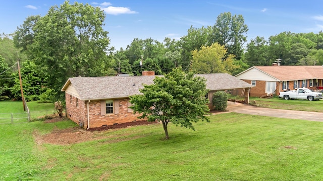 207 Oakmont Dr, Spartanburg, SC 29316 - ranch-style home featuring brick siding, driveway, a carport, roof with shingles, and a chimney
