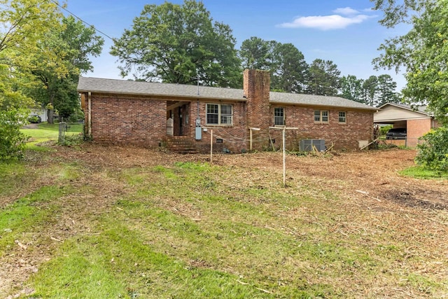207 Oakmont Dr, Spartanburg, SC 29316 - back of house with brick siding and a chimney
