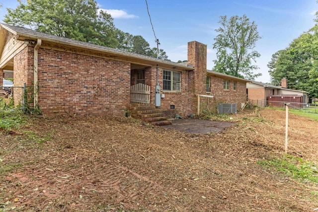 207 Oakmont Dr, Spartanburg, SC 29316 - back of property featuring a chimney and brick siding