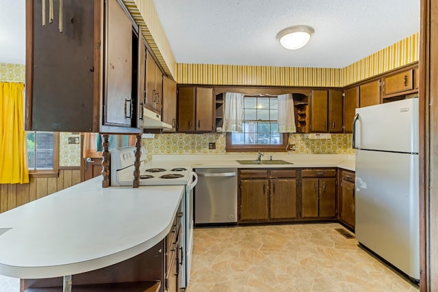 207 Oakmont Dr, Spartanburg, SC 29316 - kitchen featuring white appliances, under cabinet range hood, open shelves, light countertops, and a textured ceiling