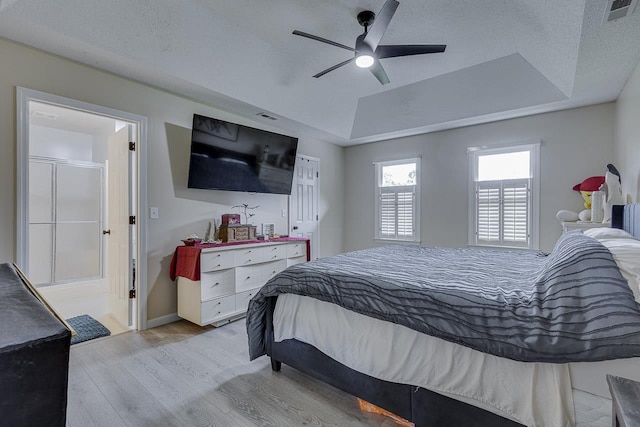 409 Cresthaven, Boiling Springs, SC 29316 - bedroom with a tray ceiling, light wood-style floors, ceiling fan, and a textured ceiling