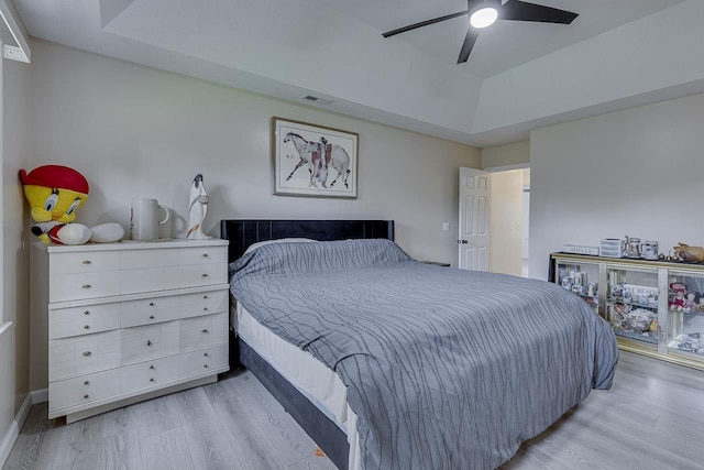 409 Cresthaven, Boiling Springs, SC 29316 - bedroom with light wood-type flooring, a raised ceiling, and a ceiling fan
