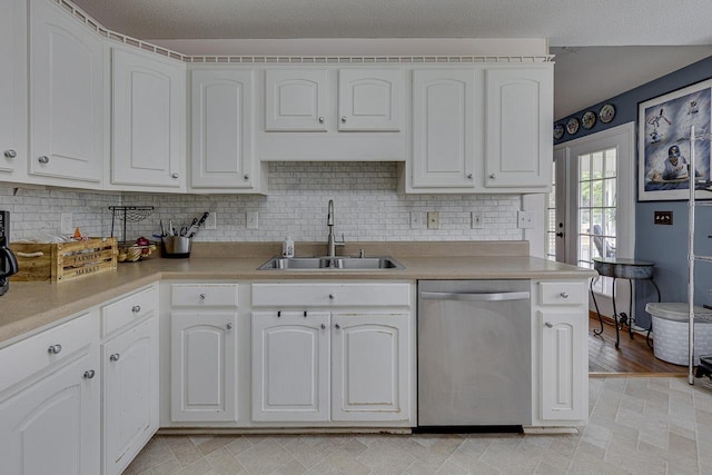 409 Cresthaven, Boiling Springs, SC 29316 - kitchen with stainless steel dishwasher, white cabinets, light countertops, and tasteful backsplash