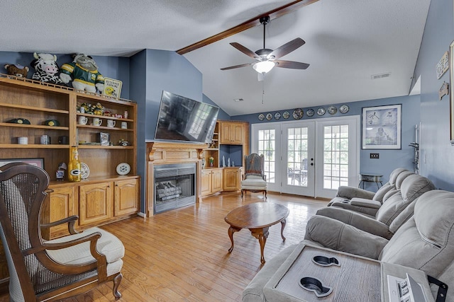 409 Cresthaven, Boiling Springs, SC 29316 - living room with a fireplace, a ceiling fan, light wood-style floors, french doors, and a textured ceiling