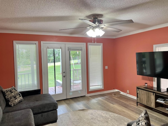 511 El Bethel Rd, Gaffney, SC 29340 - living room with french doors, a textured ceiling, wood finished floors, ornamental molding, and a ceiling fan