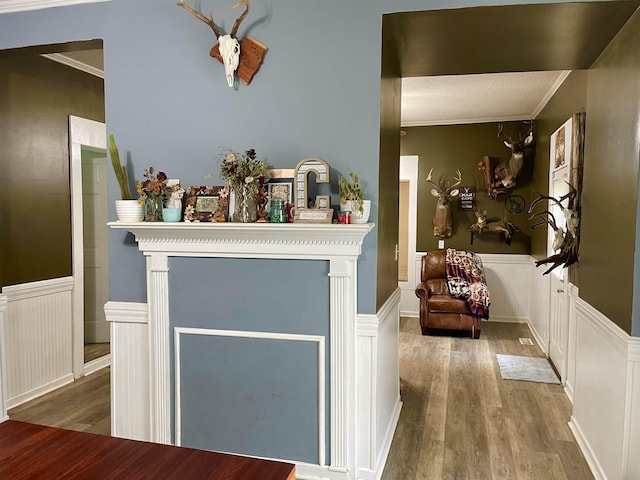 511 El Bethel Rd, Gaffney, SC 29340 - detailed view of wood finished floors, a wainscoted wall, a decorative wall, and crown molding