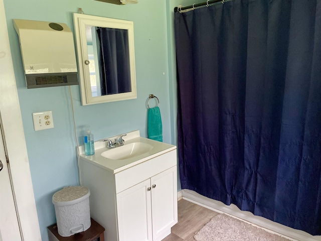 511 El Bethel Rd, Gaffney, SC 29340 - bathroom with vanity, wood finished floors, and a shower with shower curtain