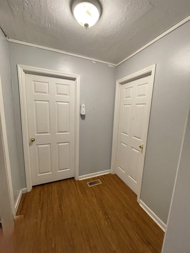 511 El Bethel Rd, Gaffney, SC 29340 - doorway to outside featuring dark wood-type flooring, a textured ceiling, and crown molding