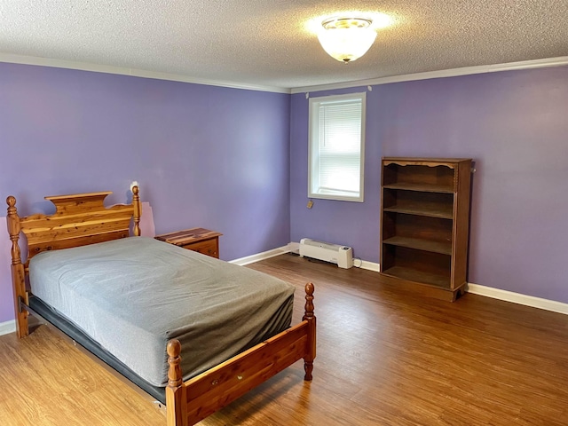 511 El Bethel Rd, Gaffney, SC 29340 - bedroom featuring a textured ceiling, wood finished floors, and ornamental molding