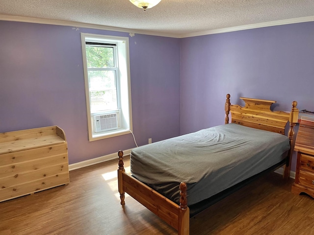 511 El Bethel Rd, Gaffney, SC 29340 - bedroom featuring cooling unit, wood finished floors, a textured ceiling, and crown molding