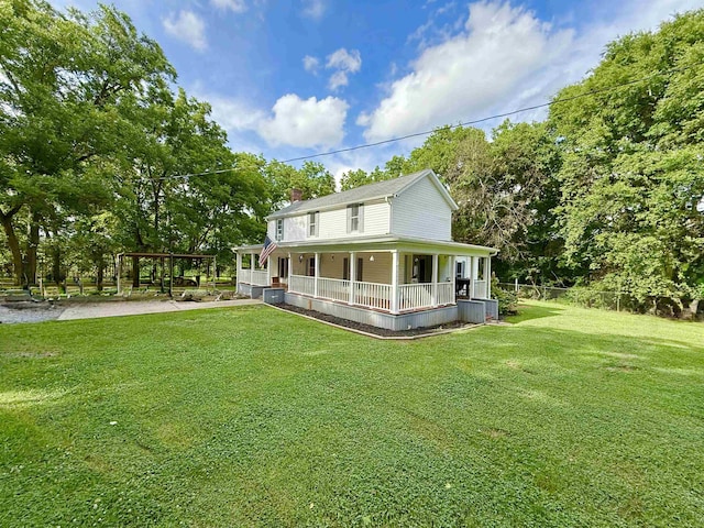 511 El Bethel Rd, Gaffney, SC 29340 - farmhouse inspired home with covered porch, a front yard, and view of wooded area