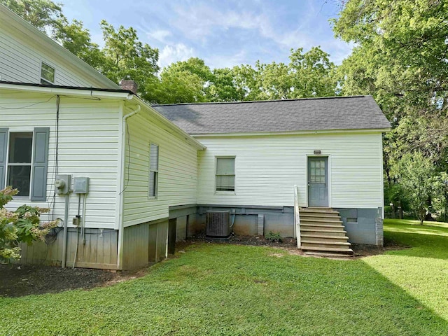 511 El Bethel Rd, Gaffney, SC 29340 - rear view of property with entry steps, a chimney, a yard, and roof with shingles