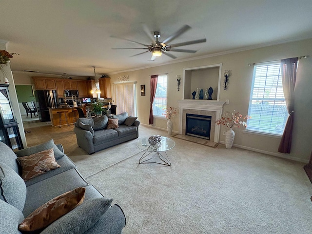 105 Pimmitt Run, Moore, SC 29369 - living area with ceiling fan, crown molding, light colored carpet, and a high end fireplace