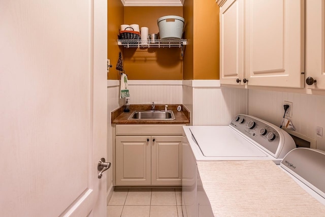 228 Antrim, Moore, SC 29369 - laundry area featuring cabinet space, independent washer and dryer, wainscoting, and light tile patterned flooring