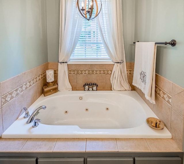 228 Antrim, Moore, SC 29369 - full bath featuring a tub with jets and a chandelier