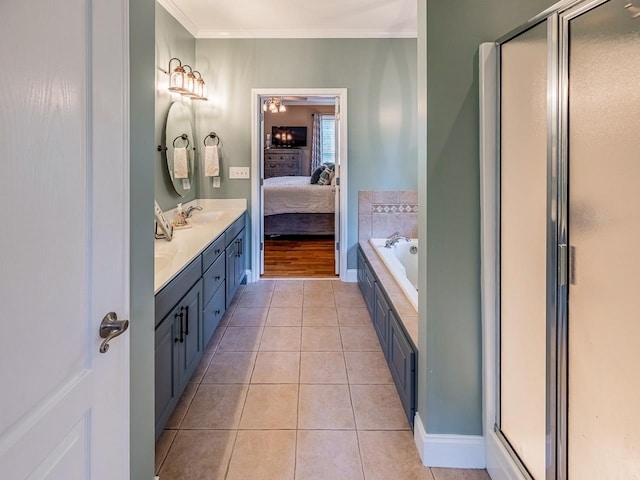 228 Antrim, Moore, SC 29369 - ensuite bathroom with double vanity, a stall shower, crown molding, a garden tub, and tile patterned flooring