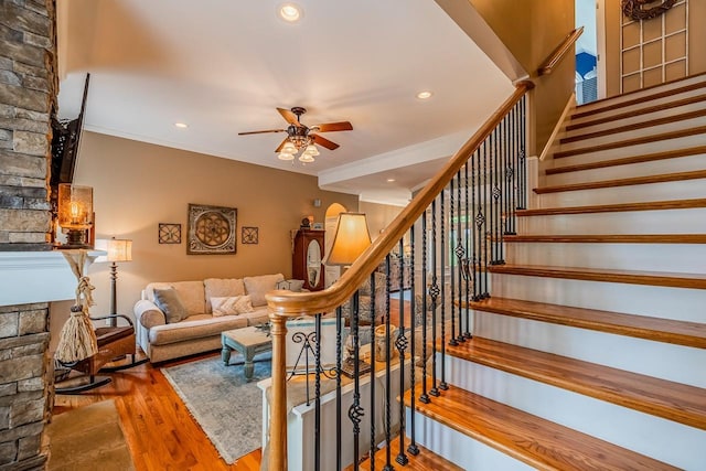 228 Antrim, Moore, SC 29369 - living area featuring ceiling fan, stairs, wood finished floors, a fireplace, and ornamental molding