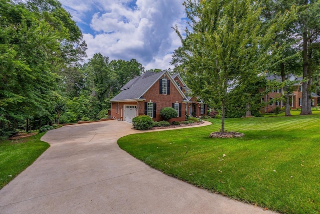 228 Antrim, Moore, SC 29369 - view of front of property featuring brick siding, a front lawn, concrete driveway, and a garage