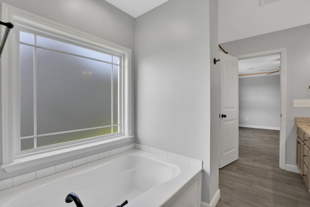 292 Long Br, Chesnee, SC 29323 - bathroom featuring vanity, a bath, healthy amount of natural light, and wood finished floors