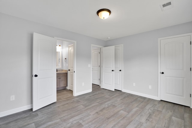 292 Long Br, Chesnee, SC 29323 - unfurnished bedroom with light wood-style floors and connected bathroom