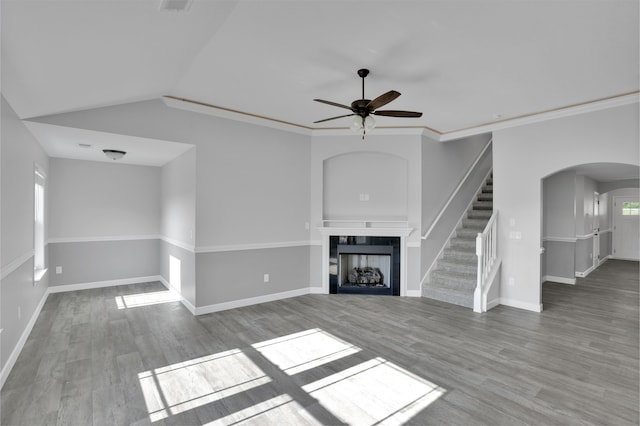292 Long Br, Chesnee, SC 29323 - unfurnished living room featuring a ceiling fan, wood finished floors, a tile fireplace, arched walkways, and stairs