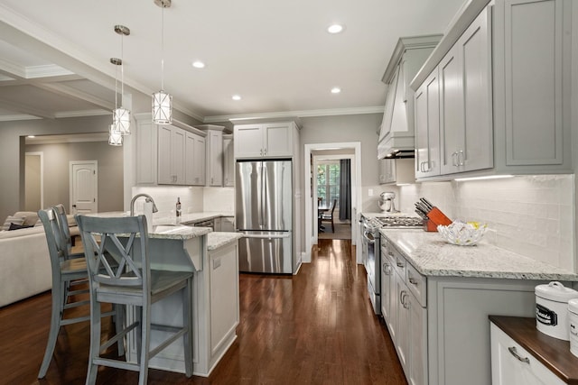 203 Piper Gln, Inman, SC 29349 - kitchen featuring appliances with stainless steel finishes, a peninsula, dark wood-type flooring, light stone countertops, and crown molding