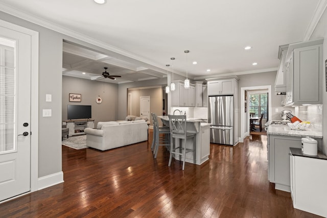 203 Piper Gln, Inman, SC 29349 - kitchen with freestanding refrigerator, recessed lighting, open floor plan, a kitchen breakfast bar, and dark wood-style floors