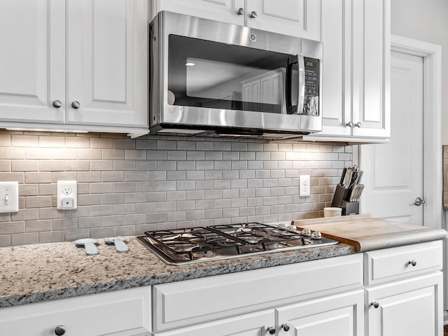 711 Hatwood, Duncan, SC 29334 - kitchen featuring stainless steel appliances, white cabinetry, and tasteful backsplash