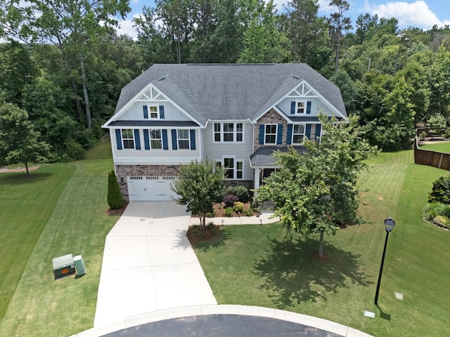 711 Hatwood, Duncan, SC 29334 - craftsman-style home with driveway, a garage, a front lawn, and stone siding