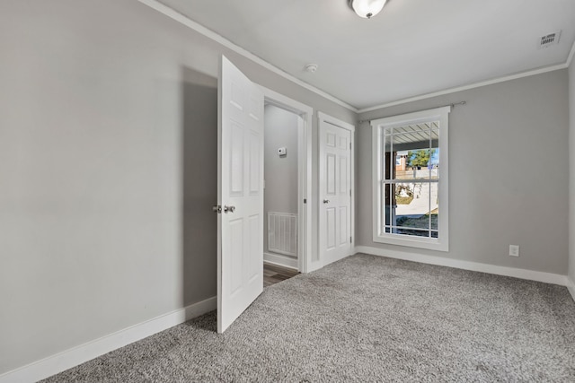562 Lowndes Hl, Greenville, SC 29607 - unfurnished bedroom with ornamental molding, carpet, and a closet