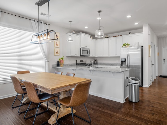 244 Cassingham, Boiling Springs, SC 29316 - kitchen featuring stainless steel appliances, a peninsula, recessed lighting, white cabinetry, and dark wood finished floors