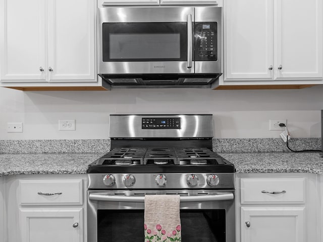 244 Cassingham, Boiling Springs, SC 29316 - kitchen featuring appliances with stainless steel finishes, white cabinetry, and light stone counters