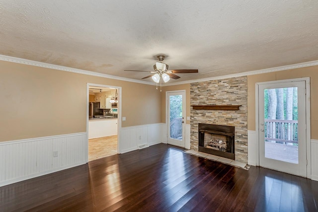 215 E Shefford, Greer, SC 29650 - unfurnished living room featuring a wainscoted wall, hardwood / wood-style flooring, a textured ceiling, ceiling fan, and healthy amount of natural light