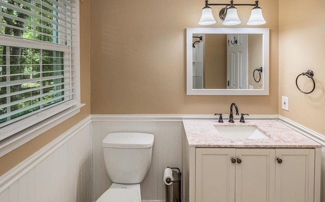 215 E Shefford, Greer, SC 29650 - bathroom featuring wainscoting, vanity, and a decorative wall