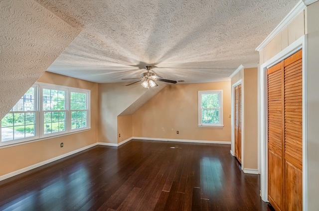 215 E Shefford, Greer, SC 29650 - additional living space featuring dark wood-style flooring, ceiling fan, and a textured ceiling