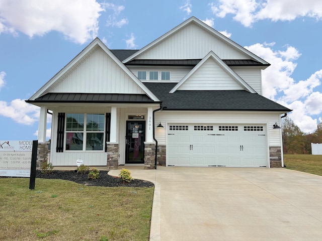 2601 Karkinnen, Moore, SC 29369 - view of front of house with stone siding, roof with shingles, board and batten siding, and driveway