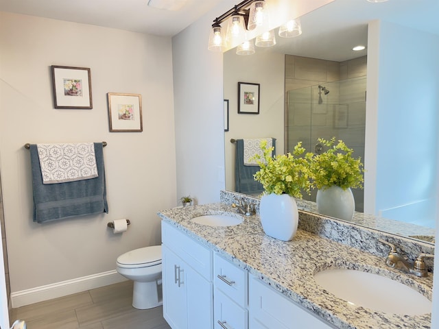 2601 Karkinnen, Moore, SC 29369 - bathroom with double vanity, a stall shower, and wood finished floors