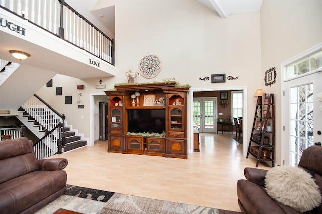 2650 Rainbow Lake Rd, Inman, SC 29349 - living room with a towering ceiling, stairway, light wood finished floors, and french doors