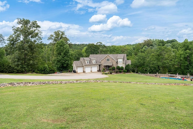 2650 Rainbow Lake Rd, Inman, SC 29349 - view of front of home featuring an attached garage, a front lawn, stone siding, concrete driveway, and a view of trees