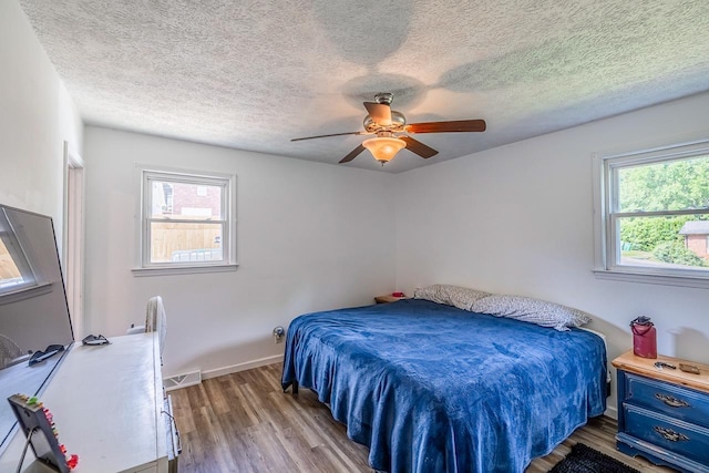 13 Thomas, Williamston, SC 29697 - bedroom featuring wood finished floors, a textured ceiling, and ceiling fan